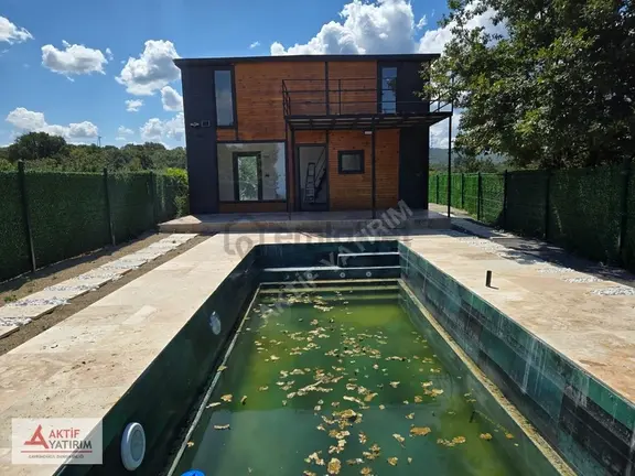 Plaja Yakın ,deniz Manzaralı İçinde Ahşap Evi Olan 500 M2 Tarla 1