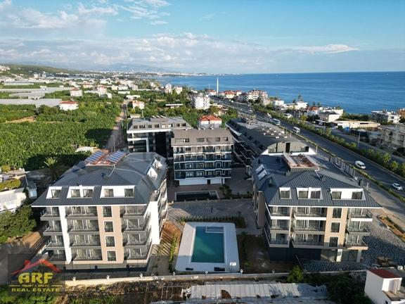 Okurcalarda Denize Yürüme Mesafesinde 1+1 Havuzlu Kiralık Daire 1