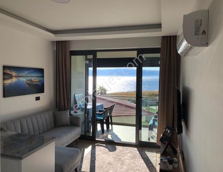 Alaçatı Gayrimenkulden Dalyan'da Denize Sıfır Sitede Satılık Daire.