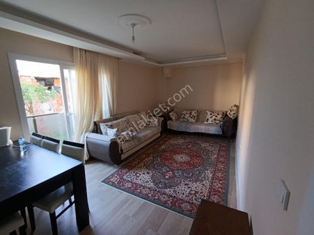 Kuşadası Davutlar Merkezde Bahçeli Satılık 2+1 Daire