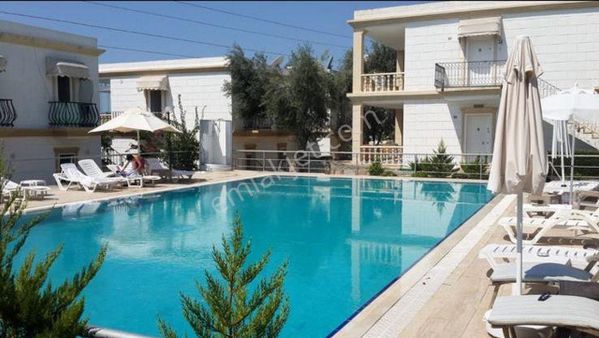 Bodrum Konacık’ta Havuzlu Butik Sitede Satılık Üst Kat Daire