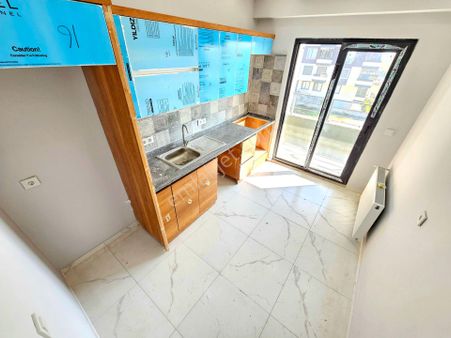 ▶ ▶ Akçay Körfez'den Ebeveyn Banyolu Ön Cephe Ara Kat Sıfır Satılık 2+1 Daire