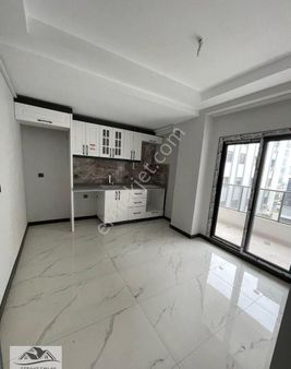 Turgutlu Satılık Ergenekon Mah 2+1 Oda 110m2 Zemin Üstü 1. Kat Yerden Isıtma Asansör Otopark Sıfır D