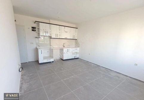 Kuşadası Davutlar'da Satılık Site İçerisinde Masrafsız 1+1 Daire