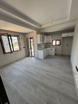 Davutlar'da Sahile Yürüme Mesafesi'nde 2+1 Sıfır Satılık Daire