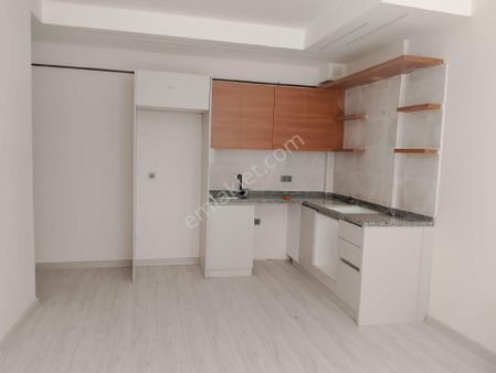 Kuşadası Merkezde 2+1 Sıfır Sahile 5 Dk. Yürüme Mesafede Satılık Daire