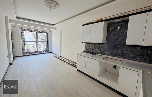 Kuşadası İkiçeşmelik'de Merkezi Lokasyon'da Sıfır 2+1 Daire