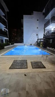 Acill Kuşadası Davutlarda Lüks Havuzlu Daire Tam Merkezde