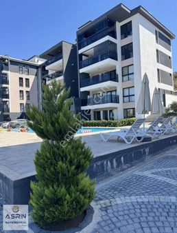 Kuşadasında Muhteşem Bir Daire Müstakil Bahçeli 2+1sıfır Havuzlu