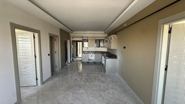 Deniz Gayrimenkul’den Sırrın Karşıyakada Satılık Sıfır+yerden Isıtmalı 2+1 Ara Kat Daire