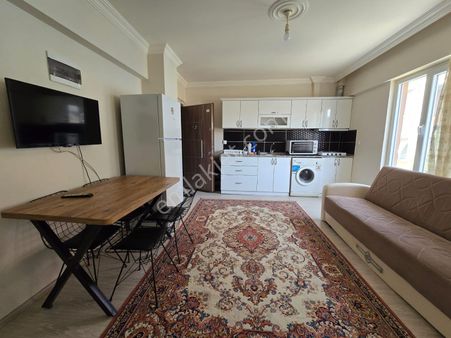 Göçmen Gayrimenkul'den Merkezde 1+1 Eşyalı Kiralık Daire