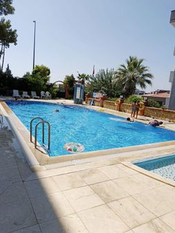 Kuşadası Değirmendere'de Havuzlu , Doğal Gaz Kombili Uygun Daire