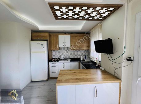 Kuşadası Davutlar'da Bahçeli Sürekli Kiralık 1+1 Eşyalı Daire