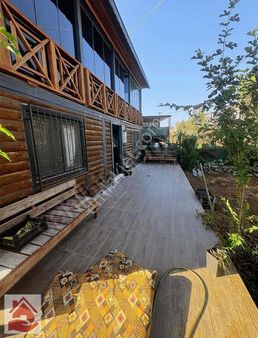 Bayramhacılıda**300 M2 Arsa İçinde **eşyalı Satılık Ahsap Ev