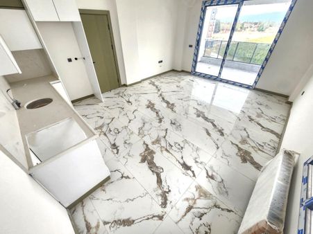 Aygülden Burhaniye Bahçelievler'de Sıfır Kat Ve Cephe Seçenekleriyle Doğalgazlı 1+1 Satılık Daireler