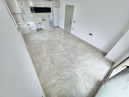 Berkay Demirel'den Zeytinlide Ön Cephe Yerden Isıtmalı 2+1 Daire