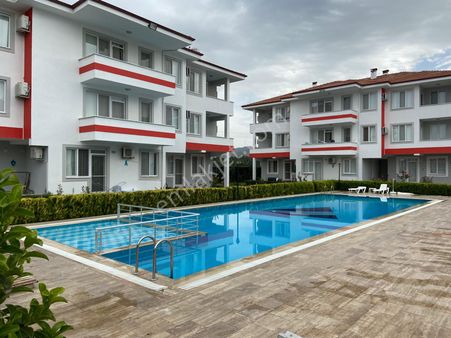 🏡 Paşa Emlak’tan – Dalaman’da Havuzlu Sitede Satılık 1+1 Ara Kat Daire