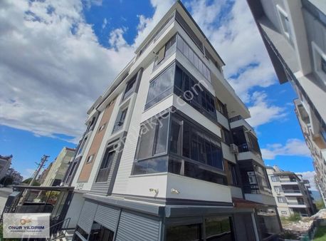 Onur Yıldırım'dan Altınkumda Cam Balkonlu Lüks 1+1 Satılık Daire