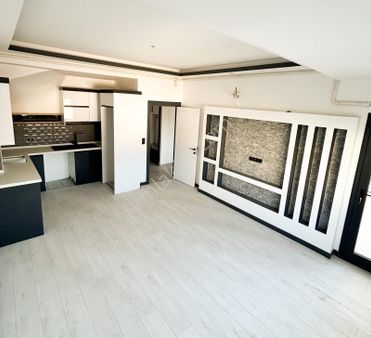 Kuşadası'nda Deniz Manzaralı Sıfır 3+1 Satılık Çatı Dubleks Daire