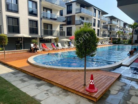 Kuşadası Davutlar’da Havuzlu Site İçerisinde 2 + 1 Daire Satılık