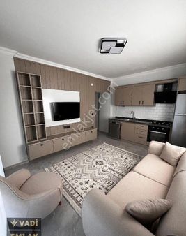 Kuşadası Davutlar'da Satılık Ful Eşyalı Bahçeli Sıfır 1+1 Daire