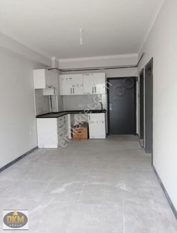 Dkm Gayrimenkul Den Merkezi Konumda Kiralık 1+1