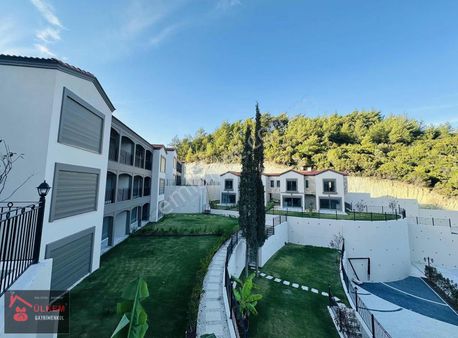 Kuşadası Davutlar Ağaçlıda Konsept 2+1 Tek Kat Bahceli Daire