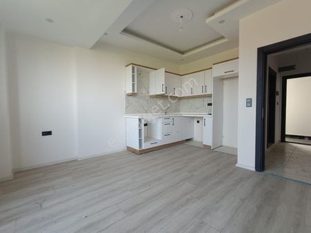 Sancak Emlaktan Kemalpaşada 1+1 Butun Cepheleri Acik Sifir Daire