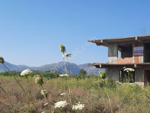 Muğla Ortaca Tepearasında 2 katlı kaba inşaatta ev ile birlikte 10 000 m2 arazi satılık.