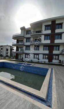 Didimde satılık çamlık mahallesinde denize 400 mt mesafede havuzlu site içinde geniş balkonlu 2+1