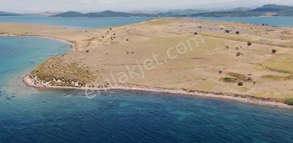 BALIKESİR AYVALIK CIPLAK ADA DA SATILIK 29,548 METRE KARE ARSA.