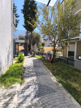 Kuşadası Güzelçamlı'da Satılık 2+1 Bahçe Katı 