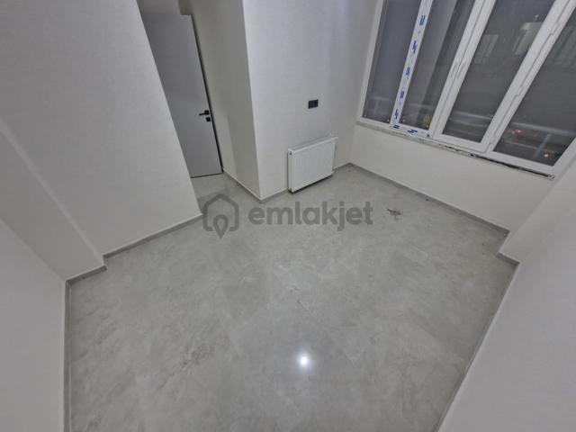 Merkezi Konumda 1+1 Sıfır Kullanışlı Satılık Daire 3