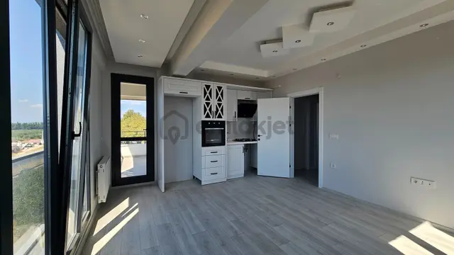 Gömeç Kemalpaşa Mahallesi'nde Cadde Üstü Kiralık Sıfır 2+1 Daire 2