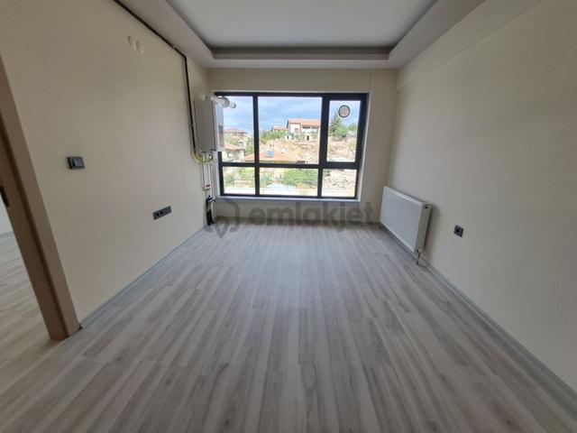 Alaçatı Gayrimenkulden İncek'te Kiralık 1+1 Daire 1