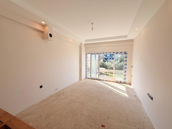 Kuşadası Güzelçamlı’da Oturma Hazır Bahçeli Satılık 2+1 Daire