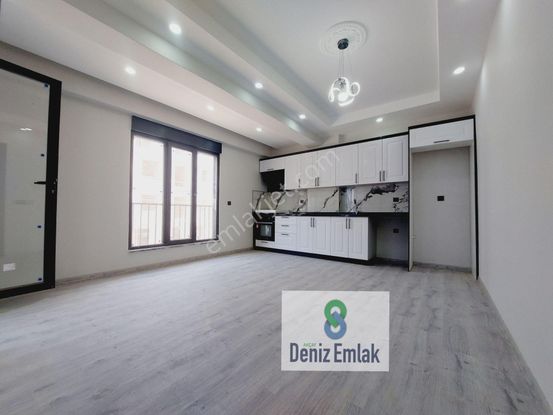 Denizden Akçayda Kapalı Otoparklı Yerden Isıtmalı Satılık 1+1 Daire.