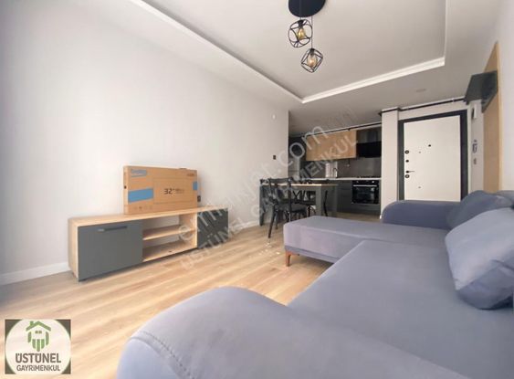 Üstünel'den Görüklede Sıfır Bina Sıfır Eşyalı 1+1 Satılık Daire