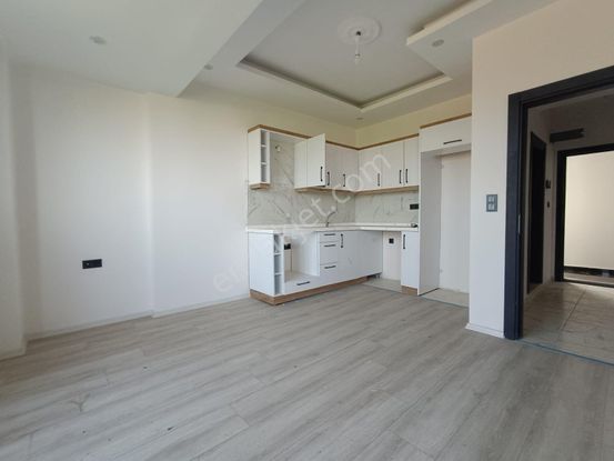 Sancak Emlaktan Kemalpaşada 1+1 Butun Cepheleri Acik Sifir Daire