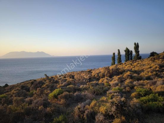 İmroz Emlak'tan Mesadi Mevkii'de 496 M2 Deniz Manzaralı Arazi